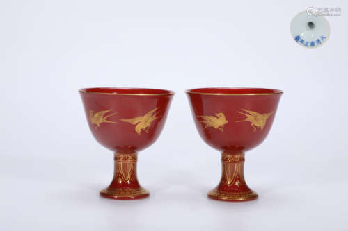 A pair of goblet cups with red gold and joy from the sky