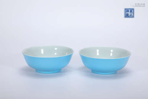 A pair of sky blue enamel flower bowls