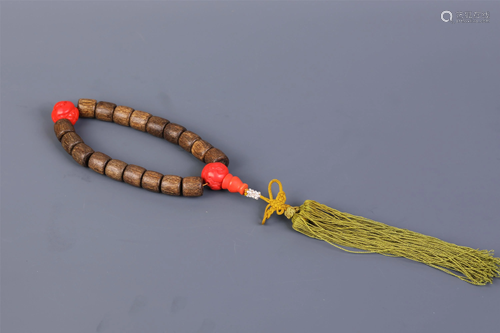 A STRING OF CHINESE CHENXIANG WOOD PRAYER BEADS