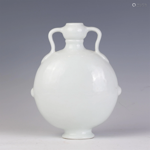 A CHINESE WHITE GLAZE AND INCISED PORCELAIN VASE