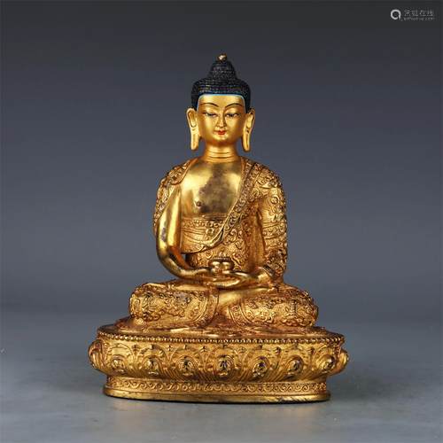 A CHINESE BRONZE SAKYAMUNI STATUETTE