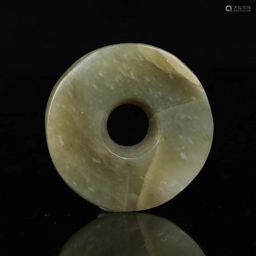 A CHINESE CIRCULAR JADE PENDANT