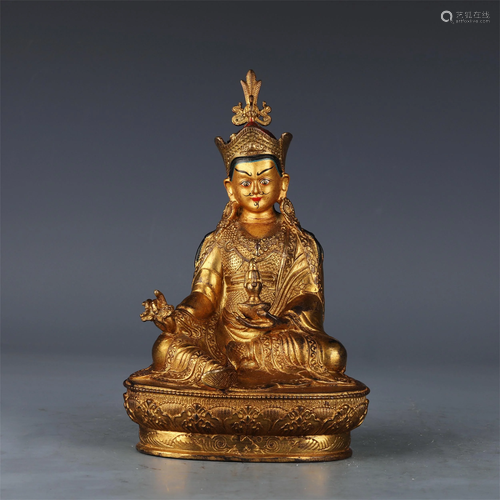 A CHINESE GILT BRONZE MEDICINE BUDDHA STATUETTE