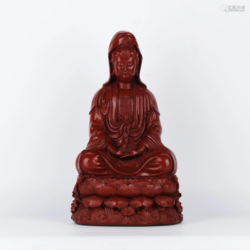 A CHINESE RED LACQUERED GUANYIN STATUETTE