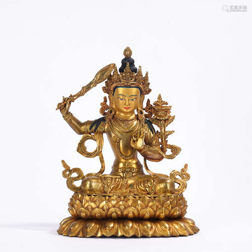 A gilt-bronze statue of Manjusri