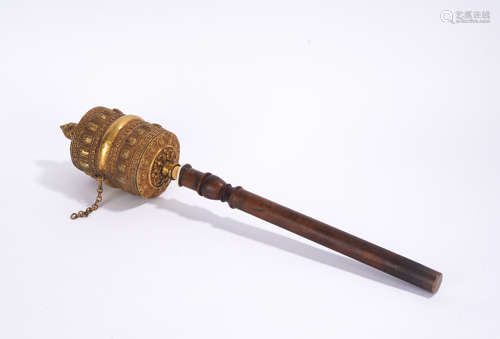 A gilt-bronze prayer wheel