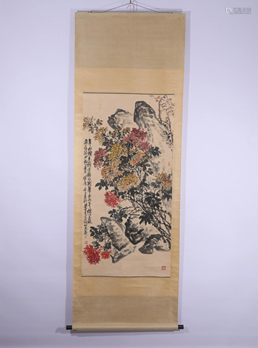 A CHINESE PAINTING OF FLOWERS AND STONE