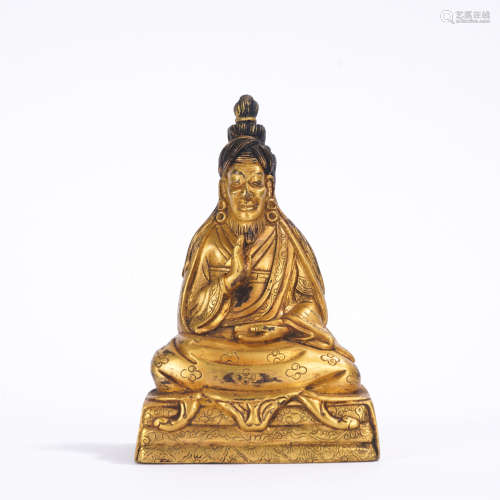 A gilt-bronze statue of Buddha