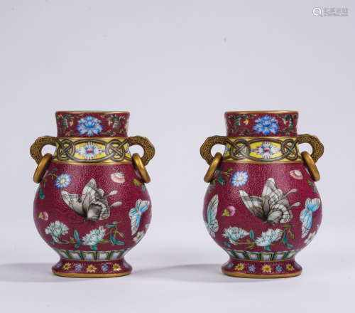 A pair of red glazed and famille-rose 'butterfly' jar