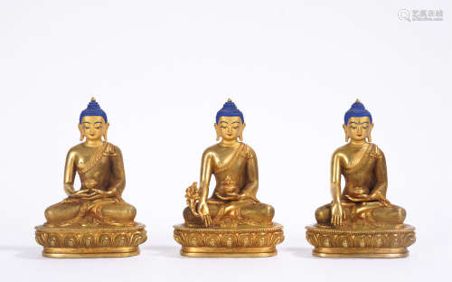A set of gilt-bronze trikalea buddhas