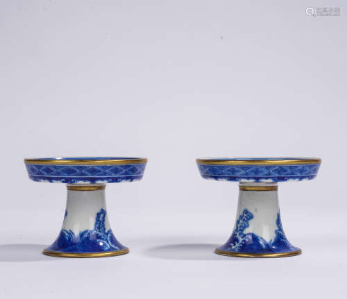 A pair of blue and white stem dish