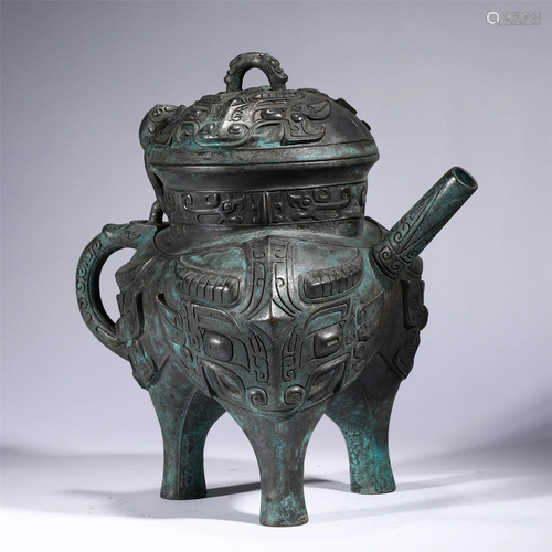 A CHINESE BRONZE BEAST-FACE TRIPOD RITUAL VESSEL