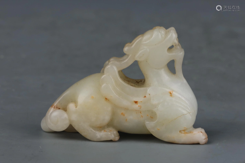 A CHINESE WHITE JADE CARVED BEAST RNAMENTS