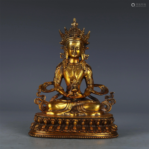 A CHINESE GILT BRONZE FIGURE OF BUDDHA SEATED STATUE