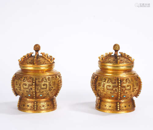 A pair of gilt-bronze jar and cover