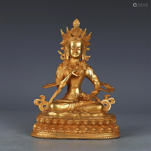 A CHINESE GILT BRONZE FIGURE OF BUDDHA SEATED STATUE