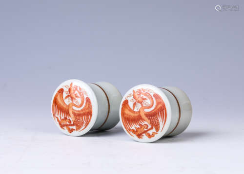 A pair of allite red glazed scroll