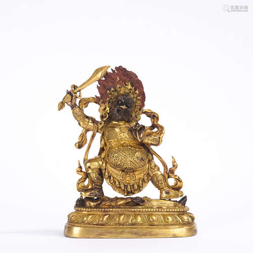 A gilt-bronze statue of Dharmapalas