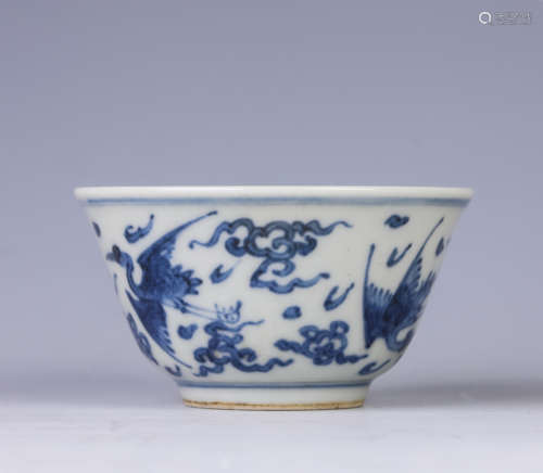 A blue and white 'crane' cup