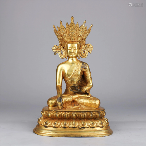 A CHINESE GILT BRONZE FIGURE OF BUDDHA SEATED STATUE