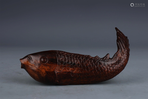 A CHINESE HARDWOOD FISH ORNAMENTS