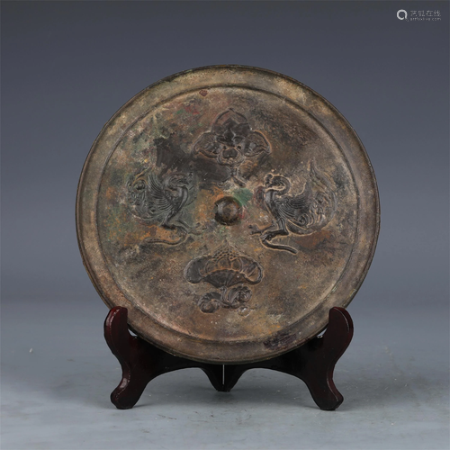 A CHINESE BRONZE MIRROR