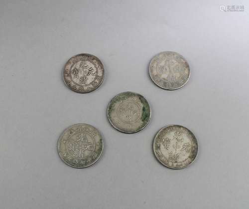 A Group of Five Chinese Silver Coins