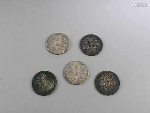 A Group of Five Chinese Silver Coins