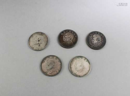 A Group of Five Chinese Silver Coins