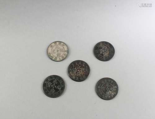 A Group of Five Chinese Silver Coins