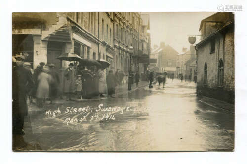 A collection of 14 photographic postcards of floods and snow...