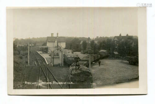 A photographic postcard titled 'Railway Station, Rudgwick', ...