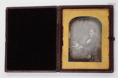 PHOTOGRAPHS. A leather-cased daguerreotype by Kilburn of a g...