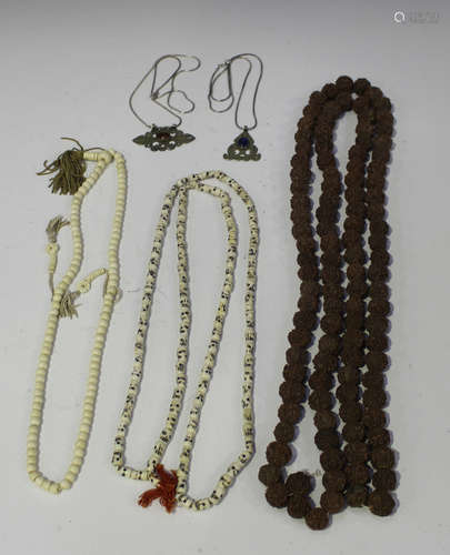 An Indian Rudraksha bead necklace, two bone necklaces and tw...