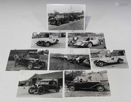 A collection of approximately 90 black and white photographs...