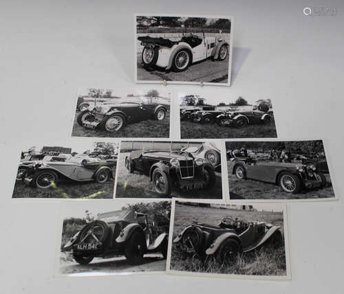 A collection of approximately 180 black and white photograph...