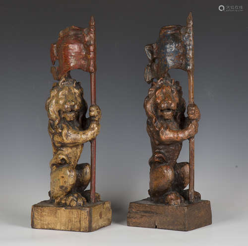 A pair of 19th century carved oak heraldic finials, each mod...