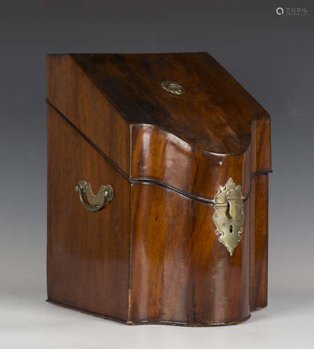 A George III mahogany knife box, the sloping lid revealing a...