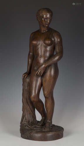 An early 20th century carved wooden full-length figure of a ...