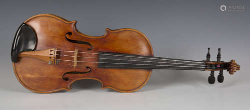 A violin with two-piece back and bearing interior label with...