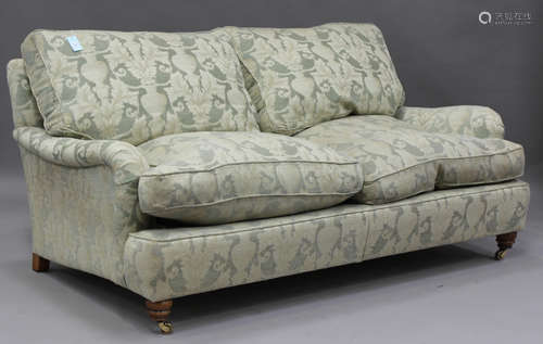 A modern Howard style two-seat sofa, upholstered in patterne...