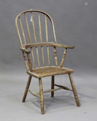 A 19th century ash and elm hoop back Windsor elbow chair, pr...