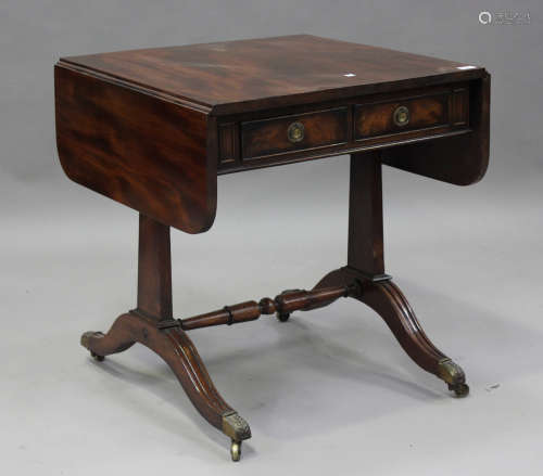 A Regency and later mahogany sofa table, fitted with fall-fl...