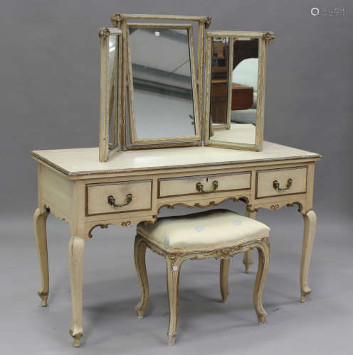 An early 20th century cream and gilt painted dressing table,...