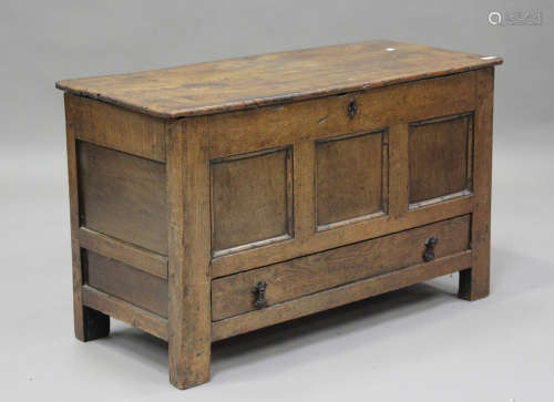 A late 17th century oak and elm panelled coffer, the hinged ...
