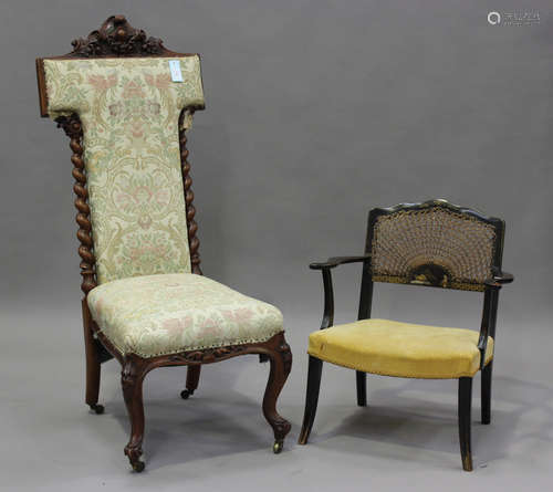 A Victorian walnut prie-Dieu chair with carved foliate scrol...