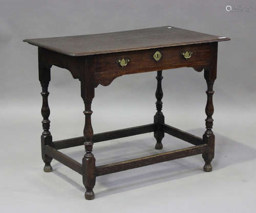 An early 18th century oak side table, fitted with a frieze d...