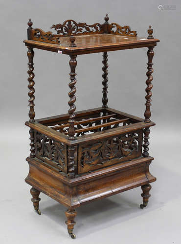 A Victorian walnut whatnot Canterbury with pierced fretwork ...