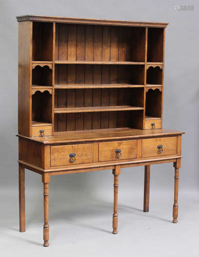 A 20th century oak dresser, the shelf back above three drawe...