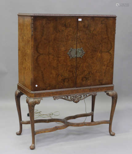 A mid-20th century Queen Anne style walnut drinks cabinet, t...